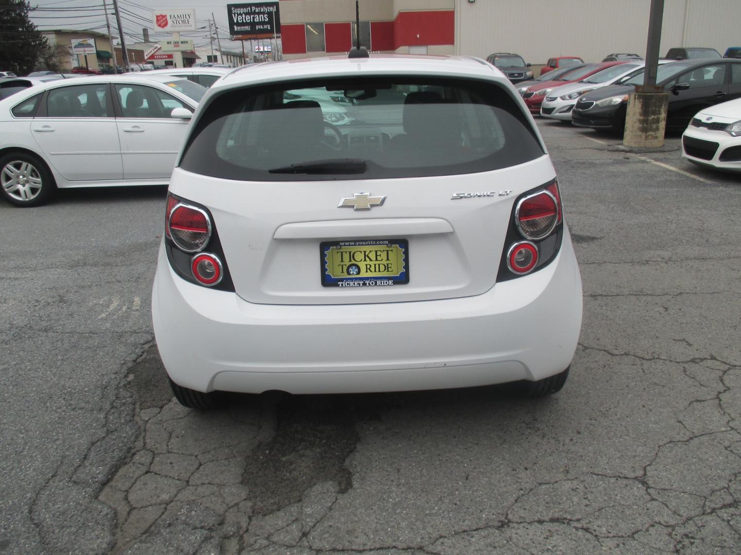 2015 WHITE Chevrolet Sonic LT Auto 5-Door (1G1JC6SH7F4) with an 1.8L L4 DOHC 24V engine, 6-Speed Automatic transmission, located at 1254 Manheim Pike, Lancaster, PA, 17601, (717) 393-9133, 40.062870, -76.323273 - Photo#4